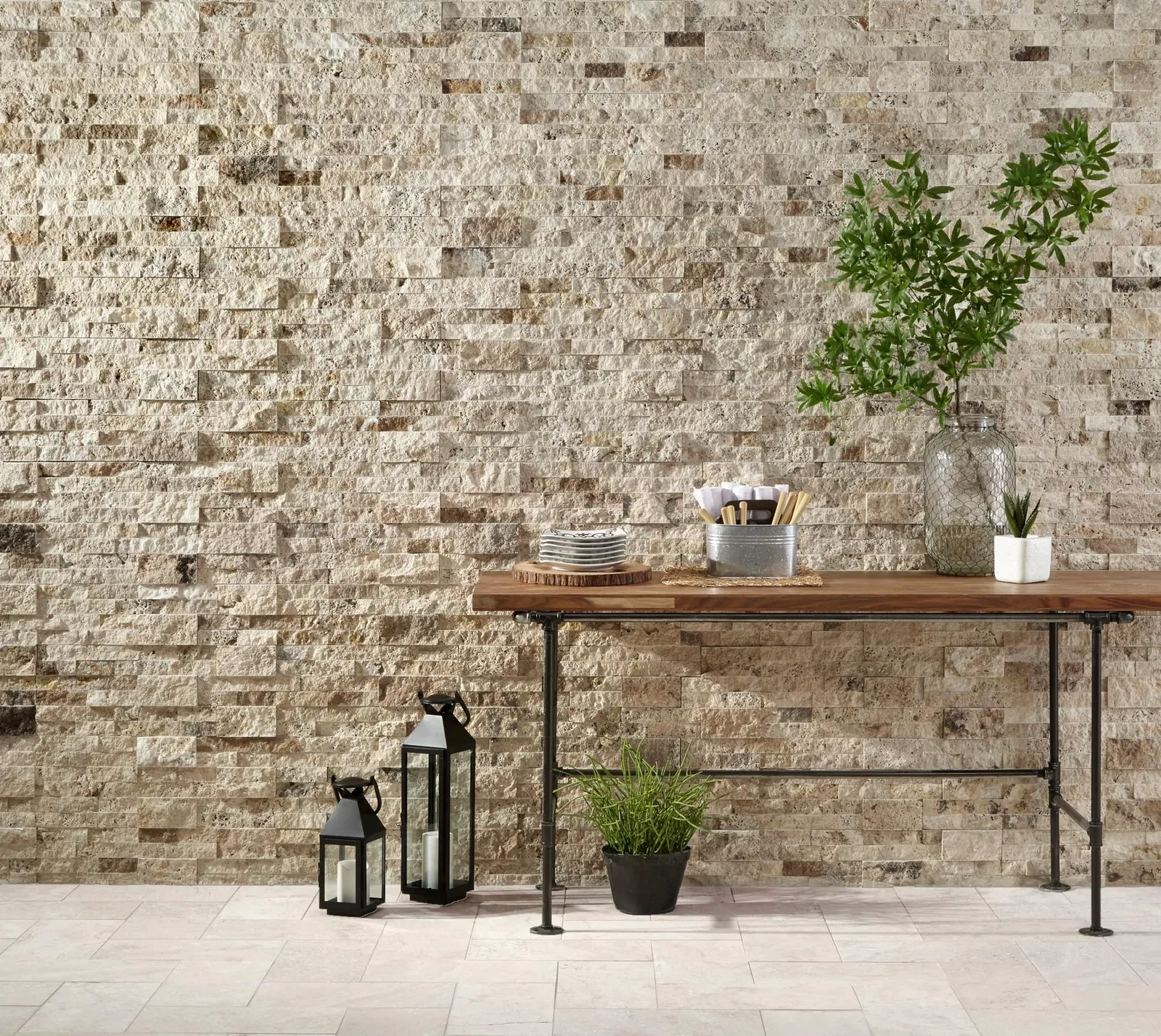 Split face travertine wall behind a console table
